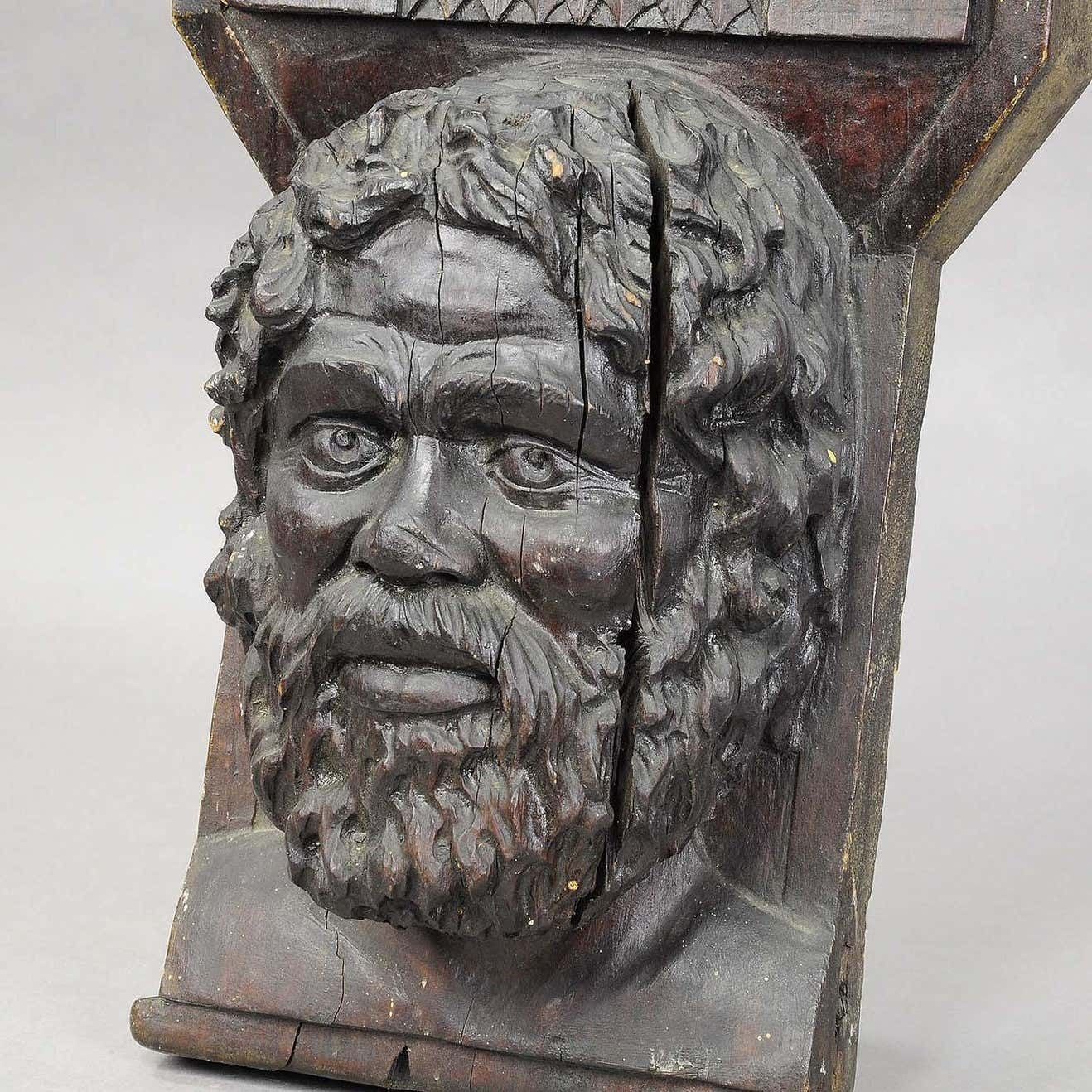 Wooden Sculpture Of A Masculine Face photo Art