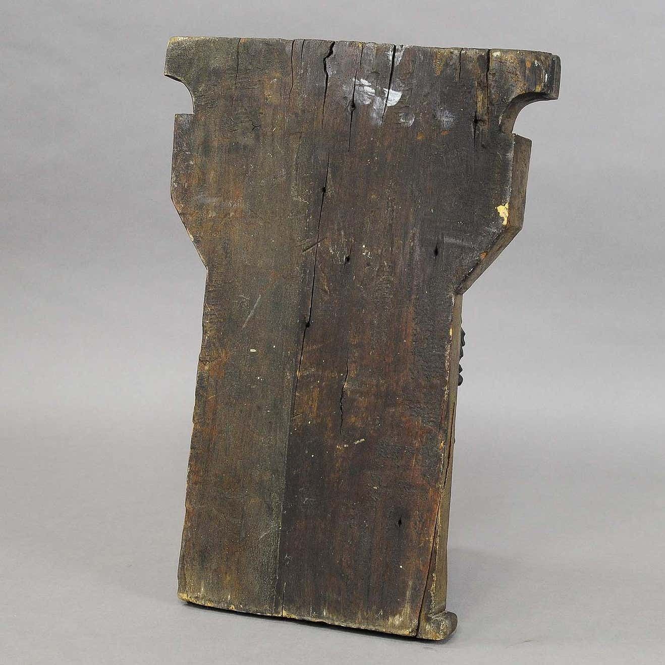 Wooden Sculpture Of A Masculine Face photo vinterior
