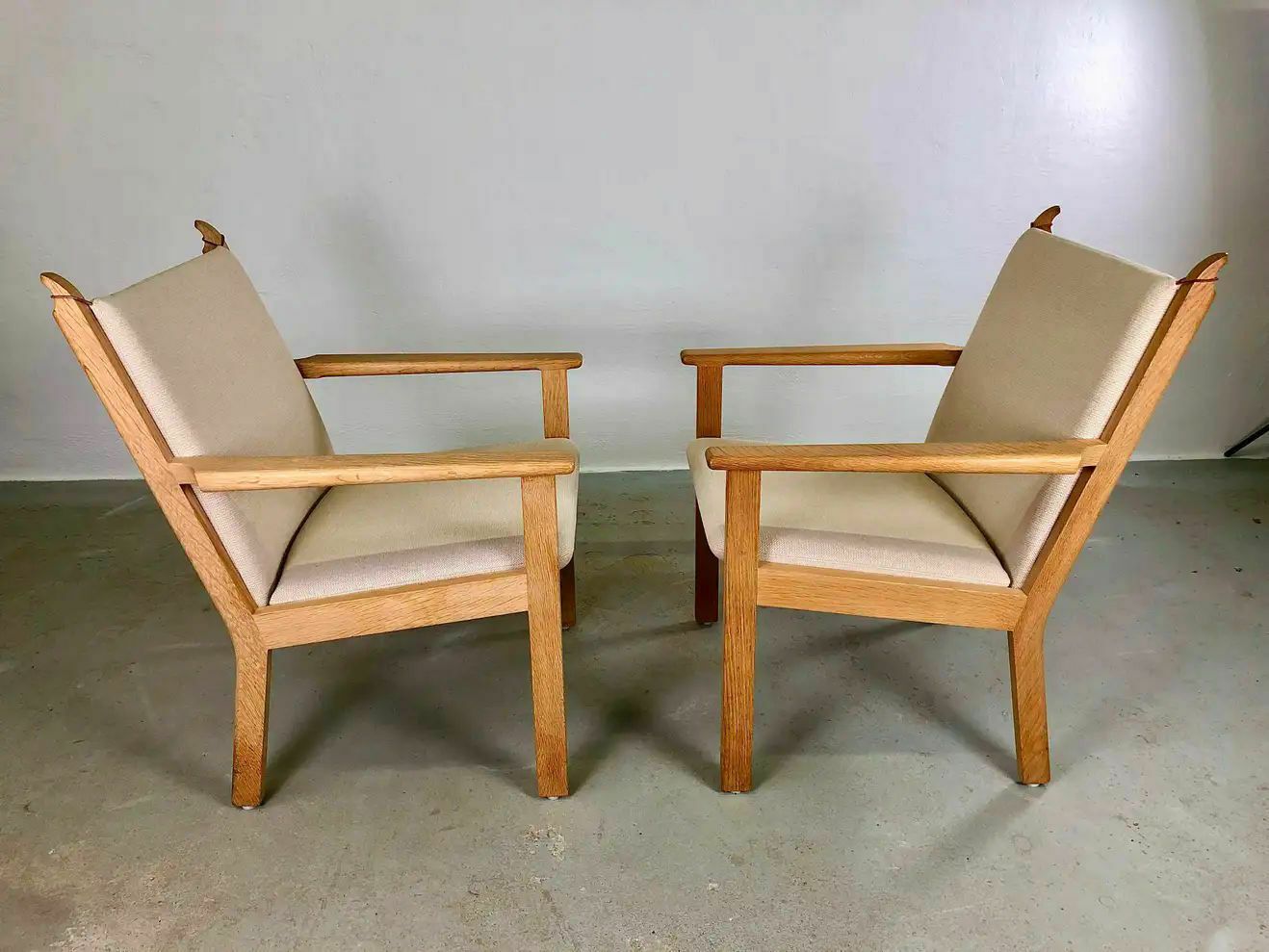 Danish Hans J. Wegner Set Of Two Lounge Chairs In Oak And Fabric By Getama photo for sale
